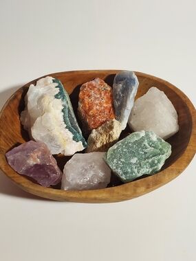 Wooden Bowl Filled with Colorful Raw Gemstones
